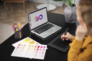 Woman designer working on app design on her laptop